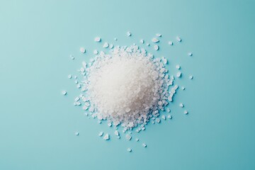 Pile of coarse white salt crystals on a blue background