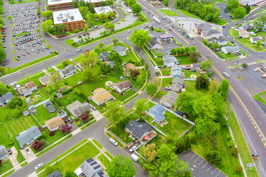 An aerial view shows suburban neighborhood with houses, roads, greenery in Bensalem town Pennsylvania