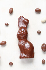 Chocolate Easter bunny with eggs on white background