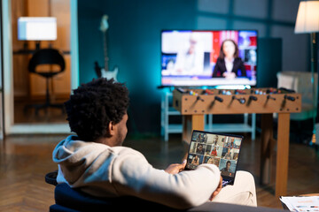 African american employee in teleconference meeting chatting with multi ethnic international team...