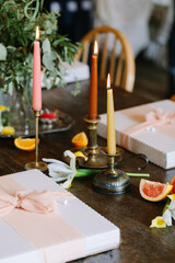 Candles, flowers, and gift boxes create a warm and inviting ambiance for a celebration