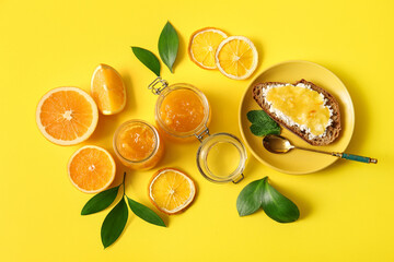 Tasty orange jam on yellow background