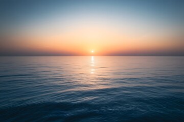 Naklejka premium Ocean Sunset: Calm Waters at Golden Hour