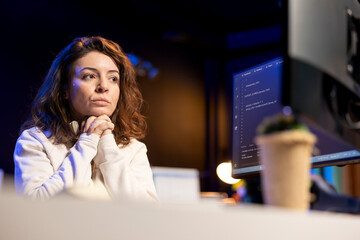 Pensive technician thinking how to design and develop software applications. Contemplative IT...