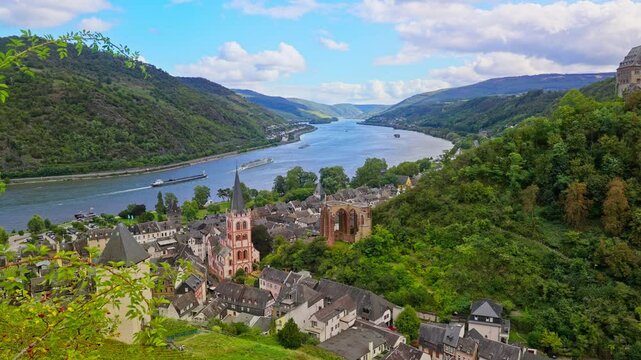 High angle view over the medieval town of Bacharach and the picturesque rhine river valley on a summer day, parallax tracking movement, Germany