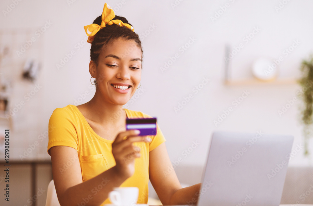 Poster online wallet and banking concept. smiling black woman using laptop and credit card, making financia