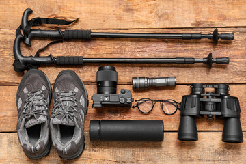 Obraz premium Composition with travel items, shoes and photo camera on wooden background
