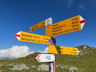 Mountaineering signposts and markings on the slopes of the Melchtal alpine valley and in the Uri Alps mountain massif, Kerns - Canton of Obwalden, Switzerland (Kanton Obwald, Schweiz)