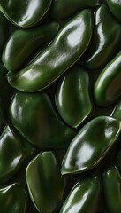 Obraz premium A macro photograph of multiple green peppers is shown