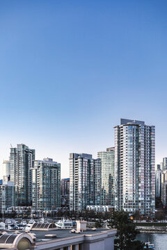 skyline in Vancouver at a winter day grey weather with skybuildings and rooftops 