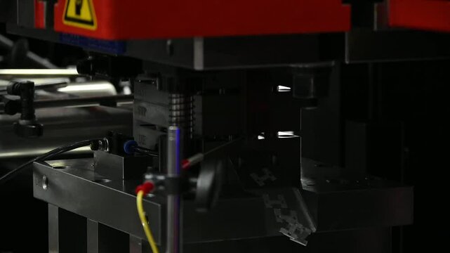 Slow motion scene the progressive die operation with press machine.