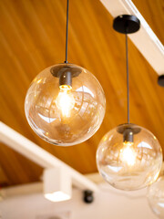 Glowing light bulbs in various places with a glassy, spherical, and reflective theme