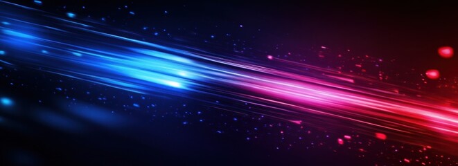 Abstract blue and red light streaks on black background.