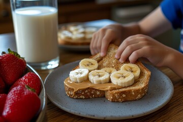 A boy takes a bite of a whole grain toast topped with peanut butter and banana slices