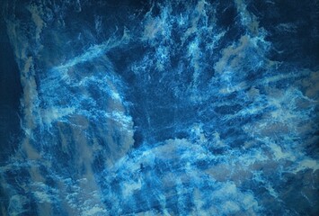 A Textured Tapestry of Light and Shadow in the Heart of the Deep Blue