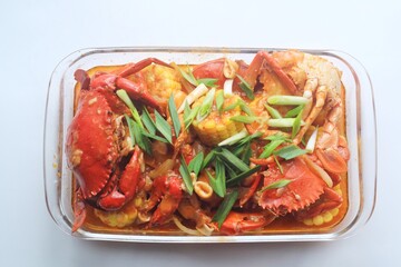 Delicious Crab in Padang sauce or an Indonesian seafood dish of crab served in hot and spicy Padang sauce with corn.

