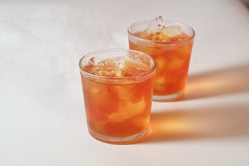 a glass of ice tea isolated on white background
