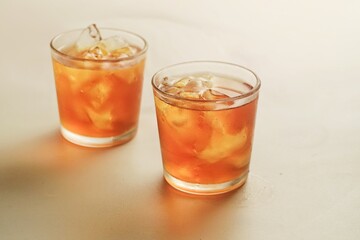 a glass of ice tea isolated on white background
