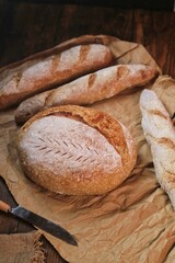 Country loaf sourdough bread on woodden table. Fresh fragrant bread on the table. Food concept. Healthy Food.
