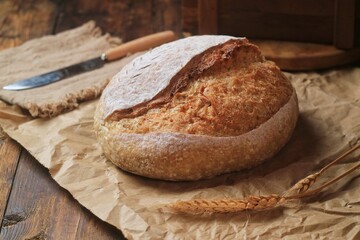 Country loaf sourdough bread on woodden table. Fresh fragrant bread on the table. Food concept. Healthy Food.
