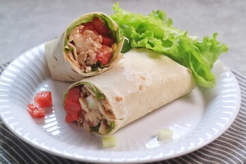 Chicken Kebab, wrap chicken with spices and veggetables with mayonaise and spicy sauce.
