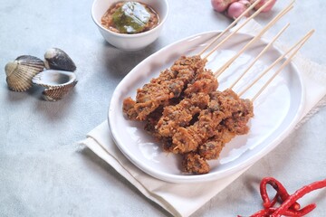 Clam Satay. Sate Kerang. Made from clams, chili, garlic, salt, spices and coconut. 
