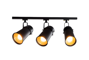 Three Industrial Style Ceiling Mounted Spotlights Illuminated in Warm Light.