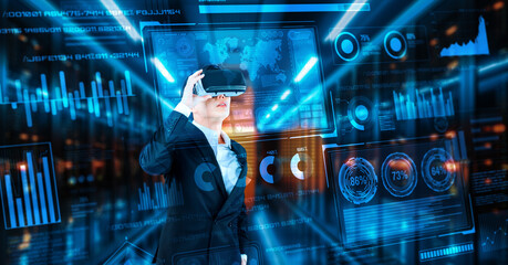 Businessman with headset standing at data center while analyzing financial data. Manager looking marketing statistic hologram and using augmented reality goggles while making a decision. Ingenuity.