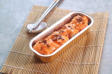 Soft focus of Dimsum Mentai Sauce. Served on the wooden tray and chopstick. Dimsum is the cuisine from Tiongkok. Its famous at all country
