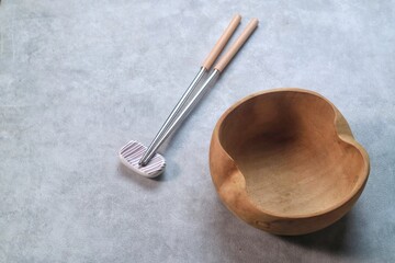 wood bowl with chopstick isolated on gray background 
