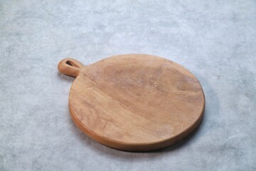 Round Cutting Board isolated on gray background with a 45 degree angle setup
