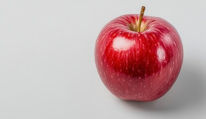 Single Red Apple With Water Droplets On Light Gray Background