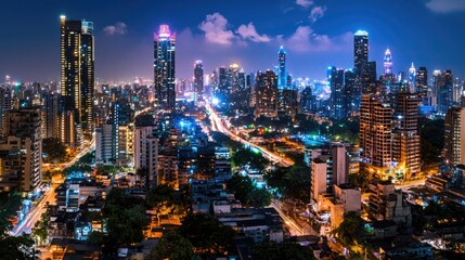 Obraz premium Nighttime Cityscape with Bright Lights and Skyscrapers in Mumbai