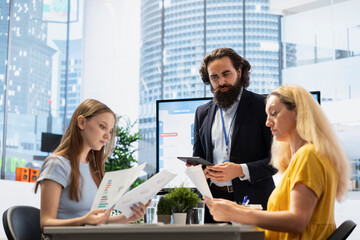 Fototapeta premium Financial advisor meeting with customers to counsel them on their finances, offering them strategy to achieve futureproof income. Economy expert giving budget management tips