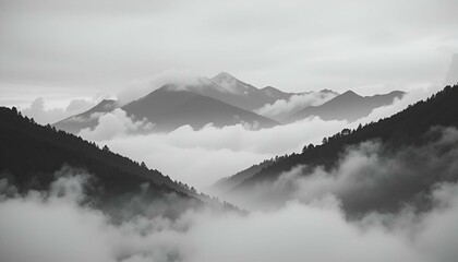  A black-and-white image of a mountain range shrouded in valley fog