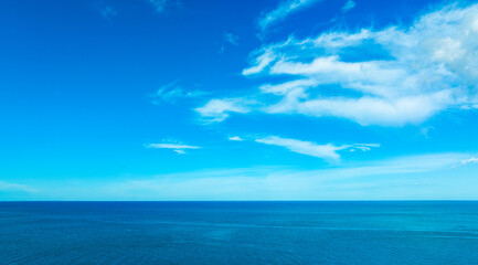 Nature of the beach and sea Summer with sunshine, sandy beaches, clear blue waters sparkling against the blue sky. On an island with good ecology and environment Background for summer vacation