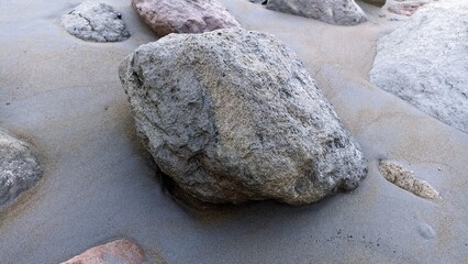 big rocks on the beach afternoon weather