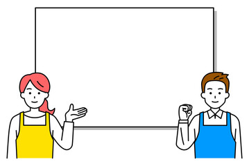 ホワイトボードの前で説明するエプロン姿の男女