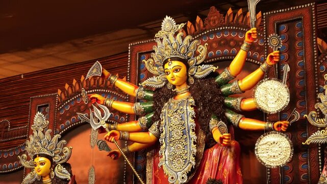 Goddess Durga in a dynamic pose with her ten hands holding divine weapons