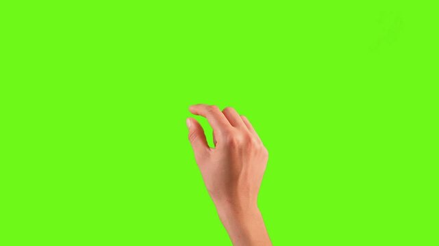 A close-up of a human hand making a pinching gesture against a chroma key (green screen) background. This isolated hand movement represents touchscreen gestures, zooming, selecting, or interactive.