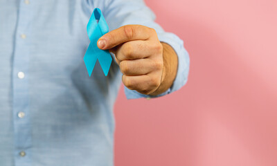 Show of support for prostate cancer awareness campaign with blue ribbon