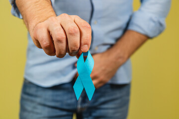 Support for men's health with blue ribbon during cancer awareness month