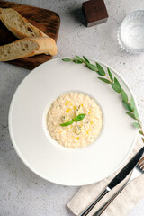 Creamy risotto 4 cheeses with parmesan, gorgonzola, brie and camembert. A dish with rice and cheese
