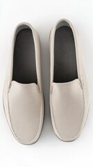 Soft gray loafers are presented on a plain surface, showcasing their casual style and texture