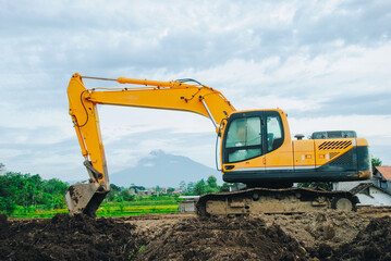 Excavator is building a road at a construction site