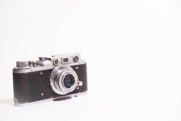 Old camera isolated on a white background. Vintage camera. Black and silver vintage camera