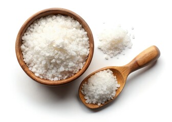 Pristine white bowl overflows with fine sea salt, a spoon rests nearby, isolated on a pure white backdrop.