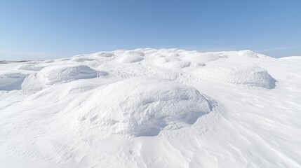 Snowdrifts on a winter plain, clear sky; winter landscape background