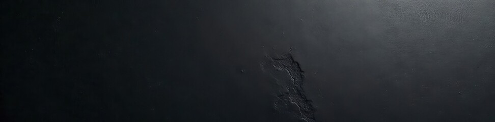 Smooth, polished black concrete; minimal detail , clean, close-up