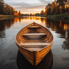 Fototapeta premium A serene wooden boat floats on tranquil waters, surrounded by autumn trees reflecting warm sunlight.